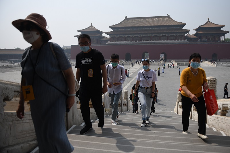 China inicia sus vacaciones con optimismo y prudencia